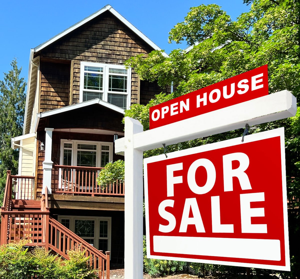 house with for sale sign in front